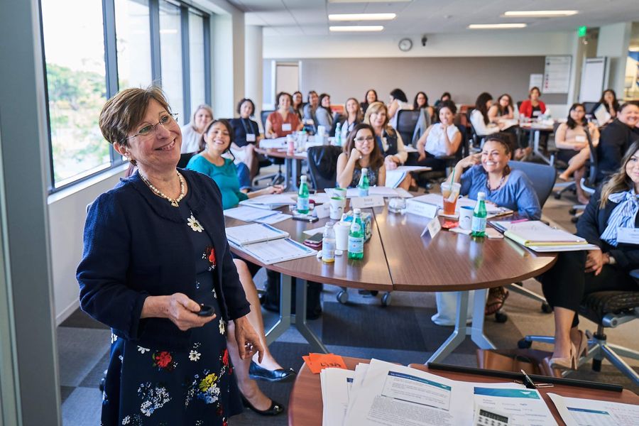 Dr. Rosa teaching a course in front of a classroom